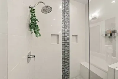 Bathroom 1: Primary En suite bathroom with dual sink vanities, large walk in shower with seating, and private toilet room with TODO bidet toilet. Bathrooms come with all soaps (hair, body, hand), towels and bathmats, and hair dryer.