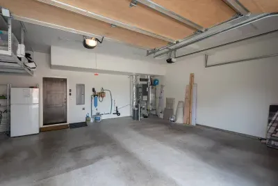 EV Charge plug in. Garage fits 2 SUVs.