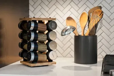 Full kitchen with quartz countertops, open to living and dining areas, island seating for 5. Kitchen is stocked with coffee, coffee maker (drip), basic seasonings, pots, pans, serveware, dishes, utensils, and kitchen appliances small and large!