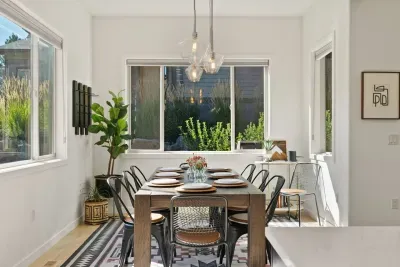 Dining area can sit up to 10 adults. Surrounded by windows and connects to the kitchen and living areas. Perfect for entertaining!