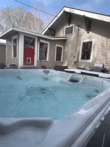 New 6 person salt water hot tub added in 2024 and is professionally cleaned between guests. It overlooks the lush and private backyard.