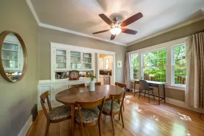 Our dining room sits up to 6 people and offers a desk and chair near the router for those who need a working space