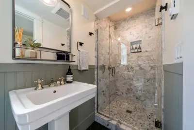 We added a second full bathroom in 2023 that has high-end, period-specific touches. We offer towels, soaps, and paper goods.