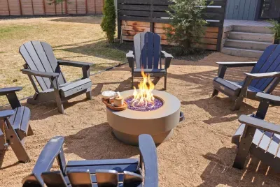 Cozy backyard fire pit with Adirondack seating—s’mores ready!