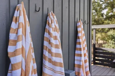 Deckside striped towels on handy hooks—perfect for pool or hot tub.