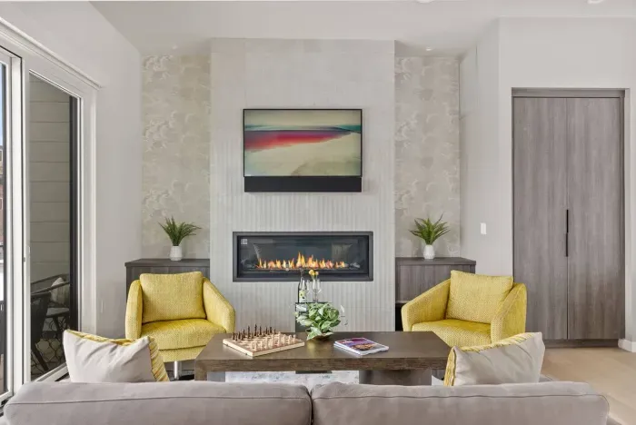 Stunning living room and open concept living. High end custom kitchen nearby with state-of-the-art appliances. An entertainer's dream! Living room opens to a south-facing balcony to welcome sunshine and fresh air!