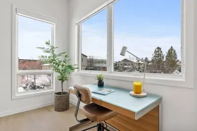 One of two work spaces that is tucked away in a nook off of the main living area. Soak in the views from your video calls and get the best lighting!