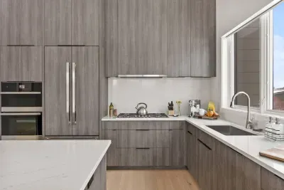 Full kitchen with beautifully integrated appliances. The kitchen comes fully stocked with all of the kitchenwares you'd have at home!