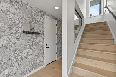 The foyer has been professionally designed and is a stunning spot to drop your coat and boots!