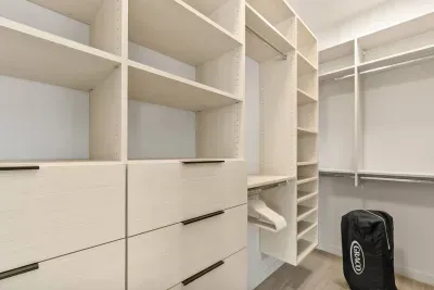 Large walk in closet in primary room includes a pack n' play that can be set up upon request