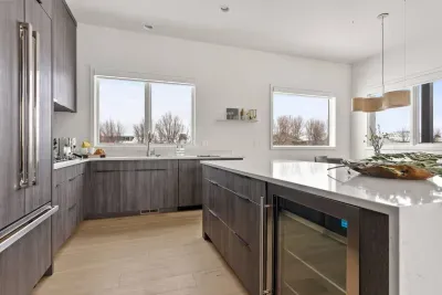 Full kitchen with beautifully integrated appliances. The kitchen comes fully stocked with all of the kitchenwares you'd have at home!