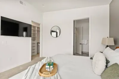 Primary room: King size bed, with incredible views from a large balcony with firepit and seating. Large walk in closet, Smart TV to stream your favorite shows, and a private luxurious bathroom with heated floors!