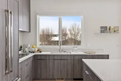 Full kitchen with beautifully integrated appliances. The kitchen comes fully stocked with all of the kitchenwares you'd have at home!