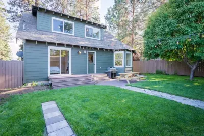 Backyard with views of main home; BBQ plummed to house with picnic table, yard games, access to guest house