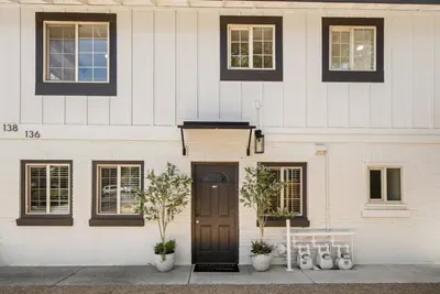 Charming townhouse exterior with stylish trim and welcoming entry