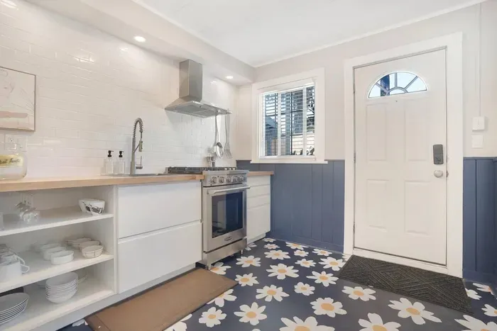 Bright modern kitchen with farmhouse sink and cheerful floral floors