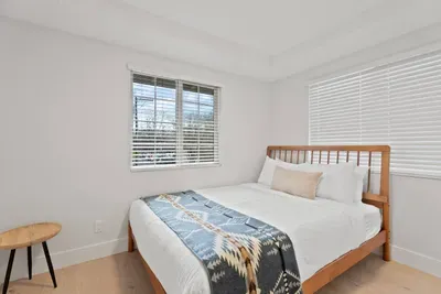 Bright, cozy bedroom with natural light and clean modern style