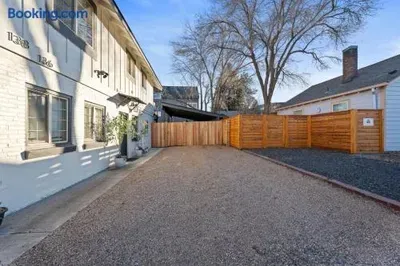 Spacious gravel driveway with private fencing and easy off-street parking