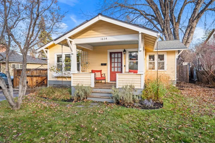 Charming Craftsman bungalow with porch seating and sunny yard