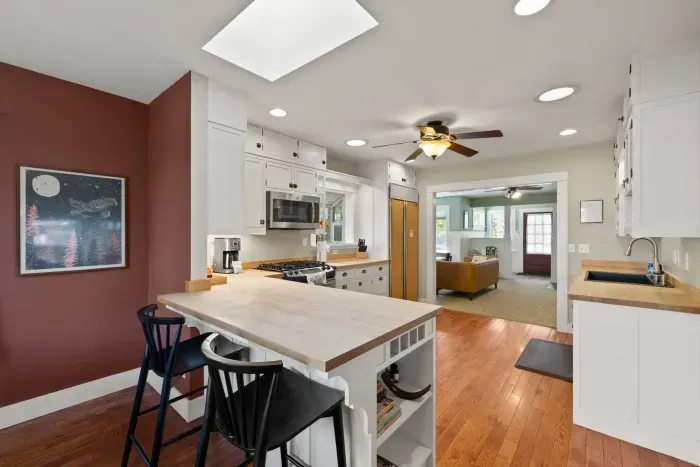 Bright open kitchen with island seating and easy flow to the living area