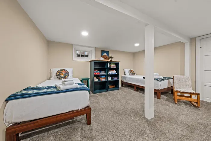 Cozy twin-bed room with games—perfect for kids or extra guests