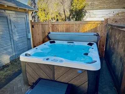 Private fenced hot tub for relaxing soaks under the stars