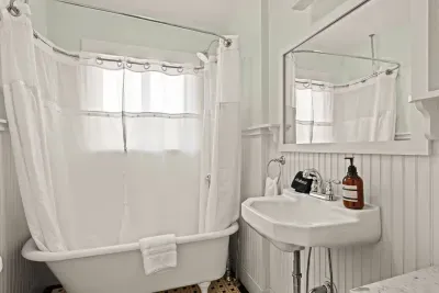 Bright vintage-style bathroom with clawfoot tub and classic charm