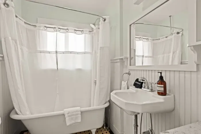 Bright vintage-style bathroom with clawfoot tub and classic charm