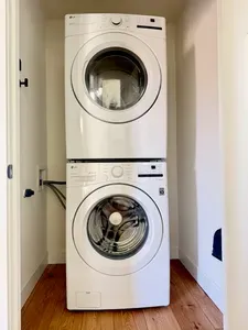 In-unit LG washer & dryer—modern, stacked convenience for easy stays.