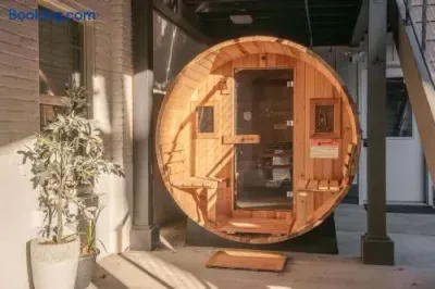 Relax in a cozy private barrel sauna with warm spa-like ambiance