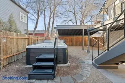 Private backyard hot tub with easy access and covered outdoor space
