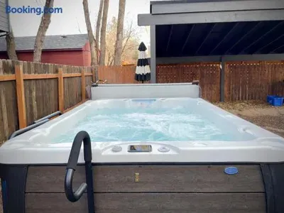 Private backyard hot tub for relaxing soaks under the open sky