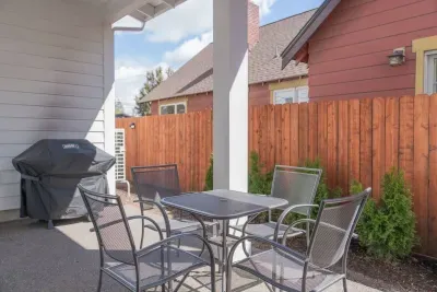 Private covered patio with grill and outdoor dining for four