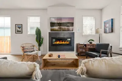 Bright, cozy living room with modern fireplace and stylish seating