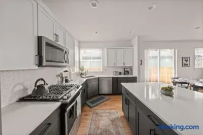 Bright modern kitchen with large island and sunny dining access