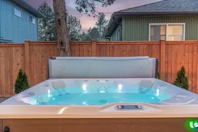 Private backyard hot tub with cozy evening ambiance