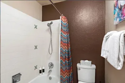 The King bedroom en suite offers a tub and shower combo.