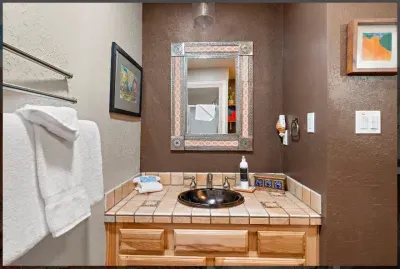 The hall shower bathroom allows the Queen bedroom guests a private space.