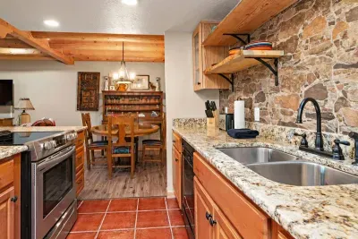 The galley kitchen includes full size appliances, a microwave, multiple coffee making options and everything you need to prepare a full meal.