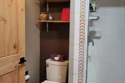 Yes, there is unique artwork in the bathroom, as well!