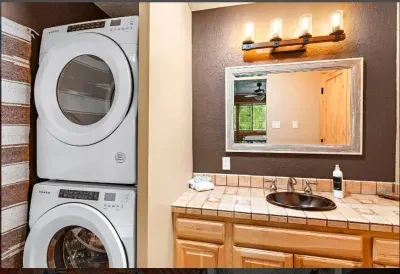 In unit washer and dryer is convientently located in the king bedroom.