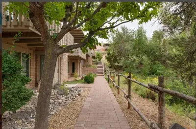 The terrain compliments the Santa Fe environment with coyote fences and wildlife.
