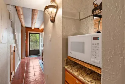 Added touches at every corner- viga beams, Saltillo floor tiles, and lighting from Mexico.