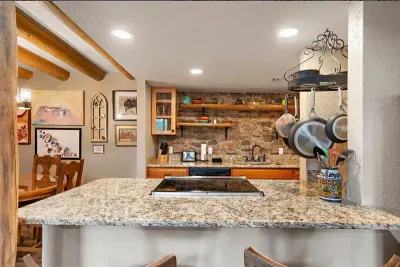 Newly renovated kitchen overlooks the living area.