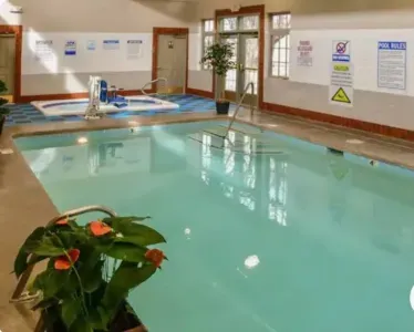 The indoor pool is approximately 20 feet long and 3-5' deep. Towels are available.