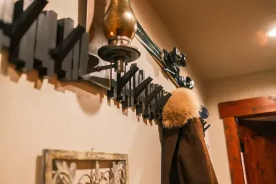 A hallway of hooks for everything! Jackets and hats and mittens, oh my!