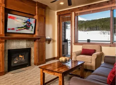 A cozy fireplace is in the main living room on Peak 7, Breckenridge.