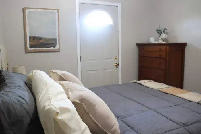 Queen bedroom with dresser storage.