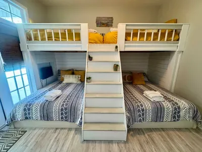 the bunk room is perfect for sleepovers with 2 full mattresses and 2 twins. there is a bathroom that is accessible from the hall but can also be enclosed within this room by closing the door in the hallway