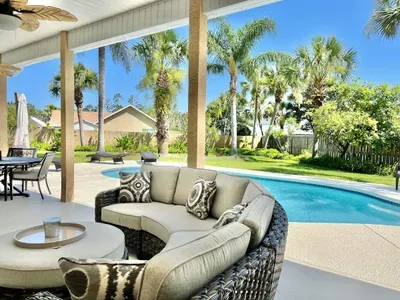 relax near the pool either in the sun or covered and with fans to keep you cool